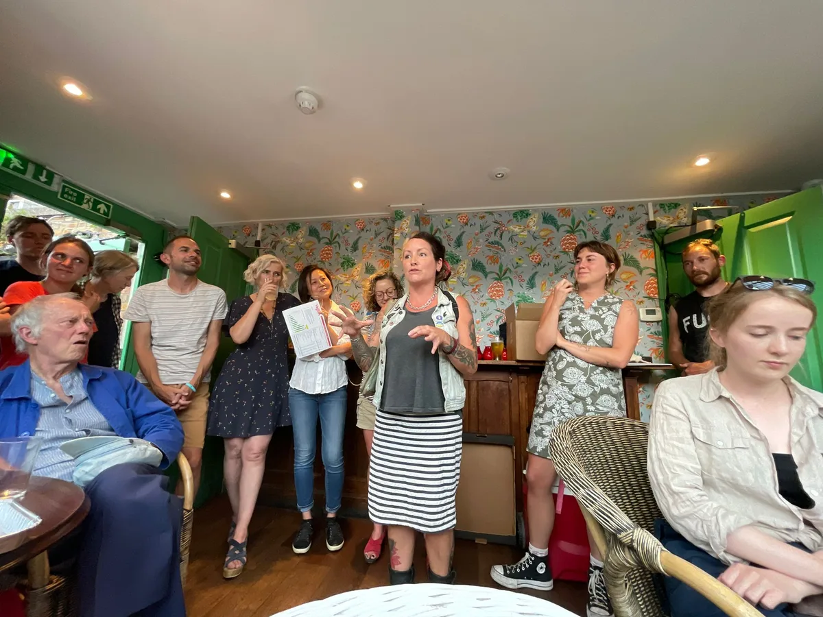 A packed room of Vegbox members listening to a board update at the AGM
